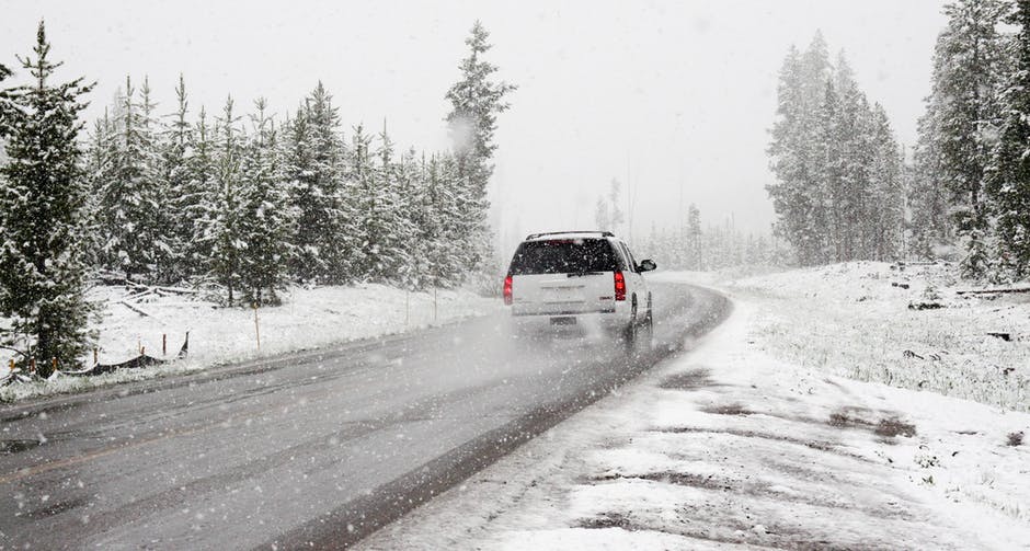 Photo of car on snowy road